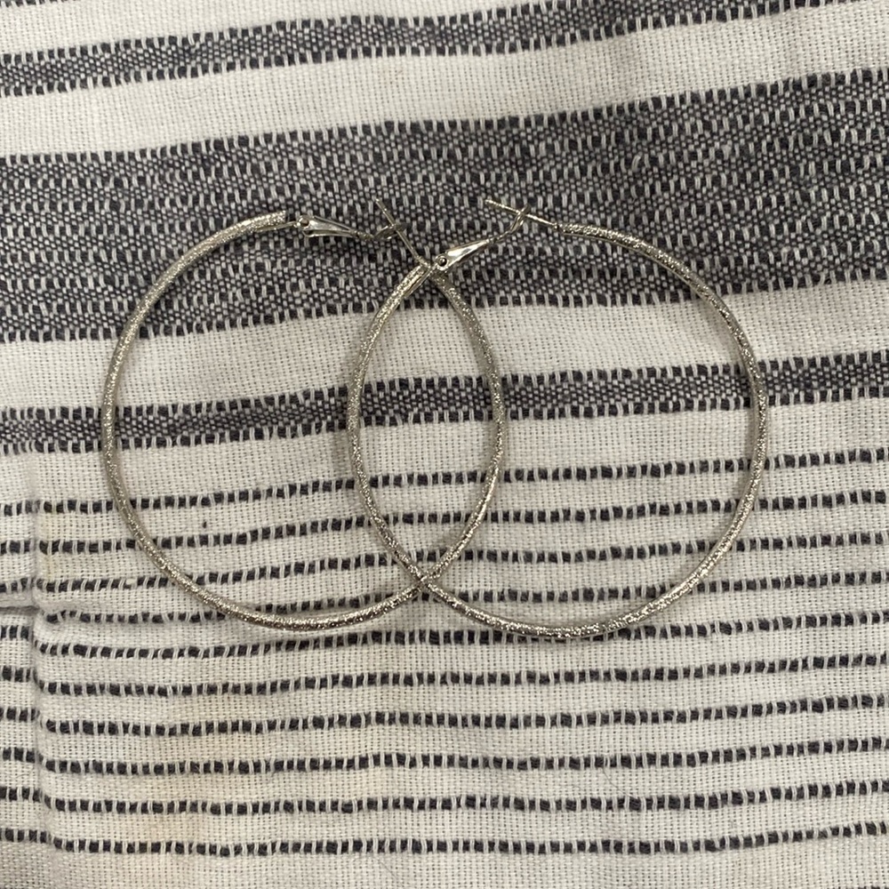 Never worn silver sparkly hoops